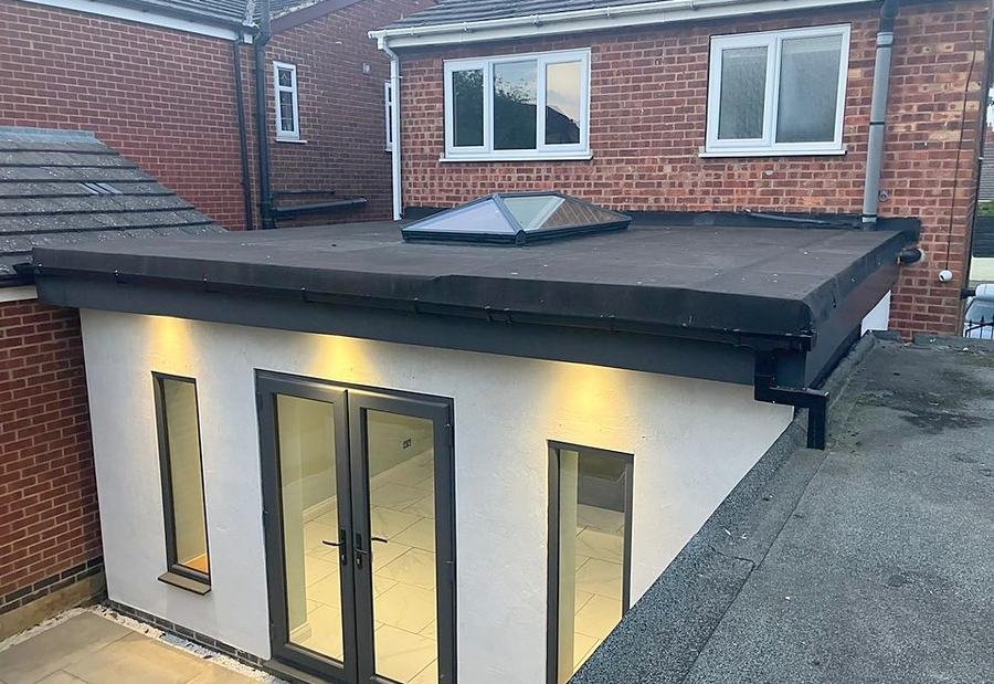 Completed rear extension lit from inside at dusk